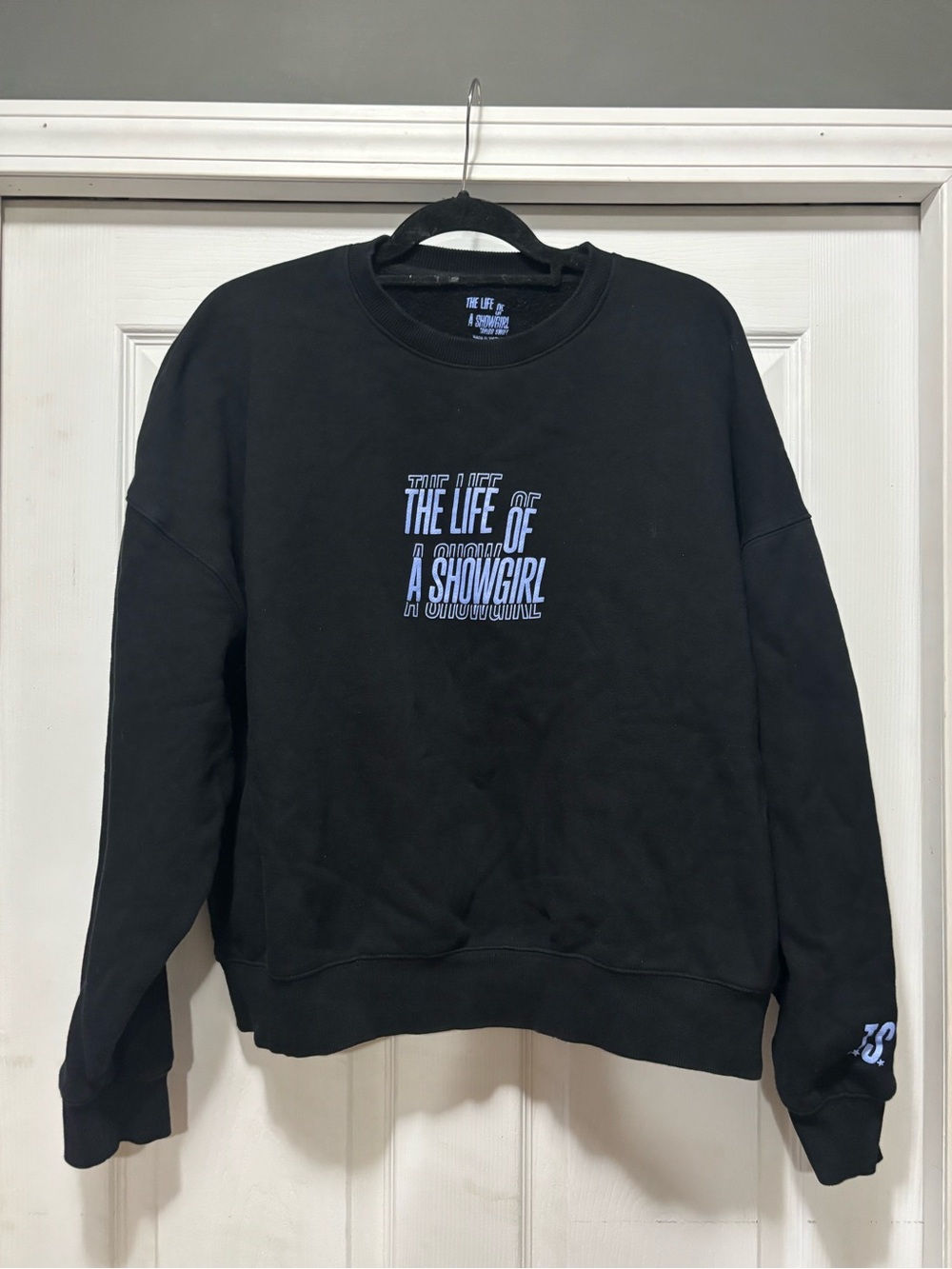 Taylor Swift Black Crewneck Sweatshirt with Blue Graphic Text